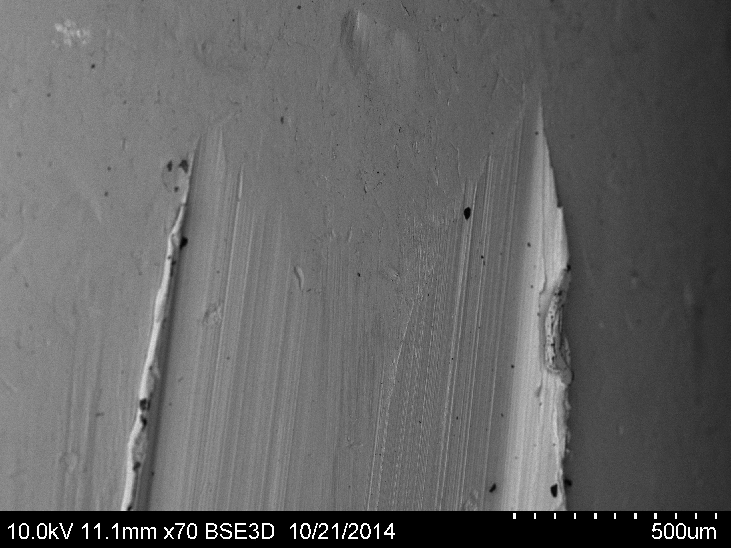 Micrograph of the beginning of rifled groove engraved on a .30" copper-jacketed bullet.